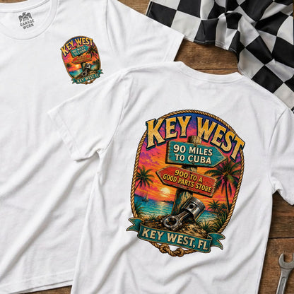 White t-shirt with Key West sunset graphic and piston detail.