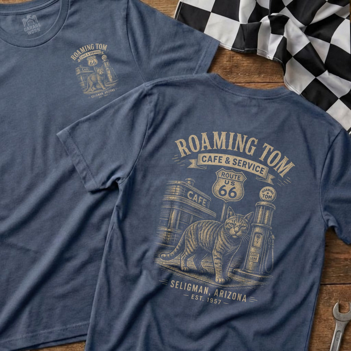 Blue t-shirt with Roaming Tom Route 66 cat graphic and "Seligman, Arizona Est. 1957" text.