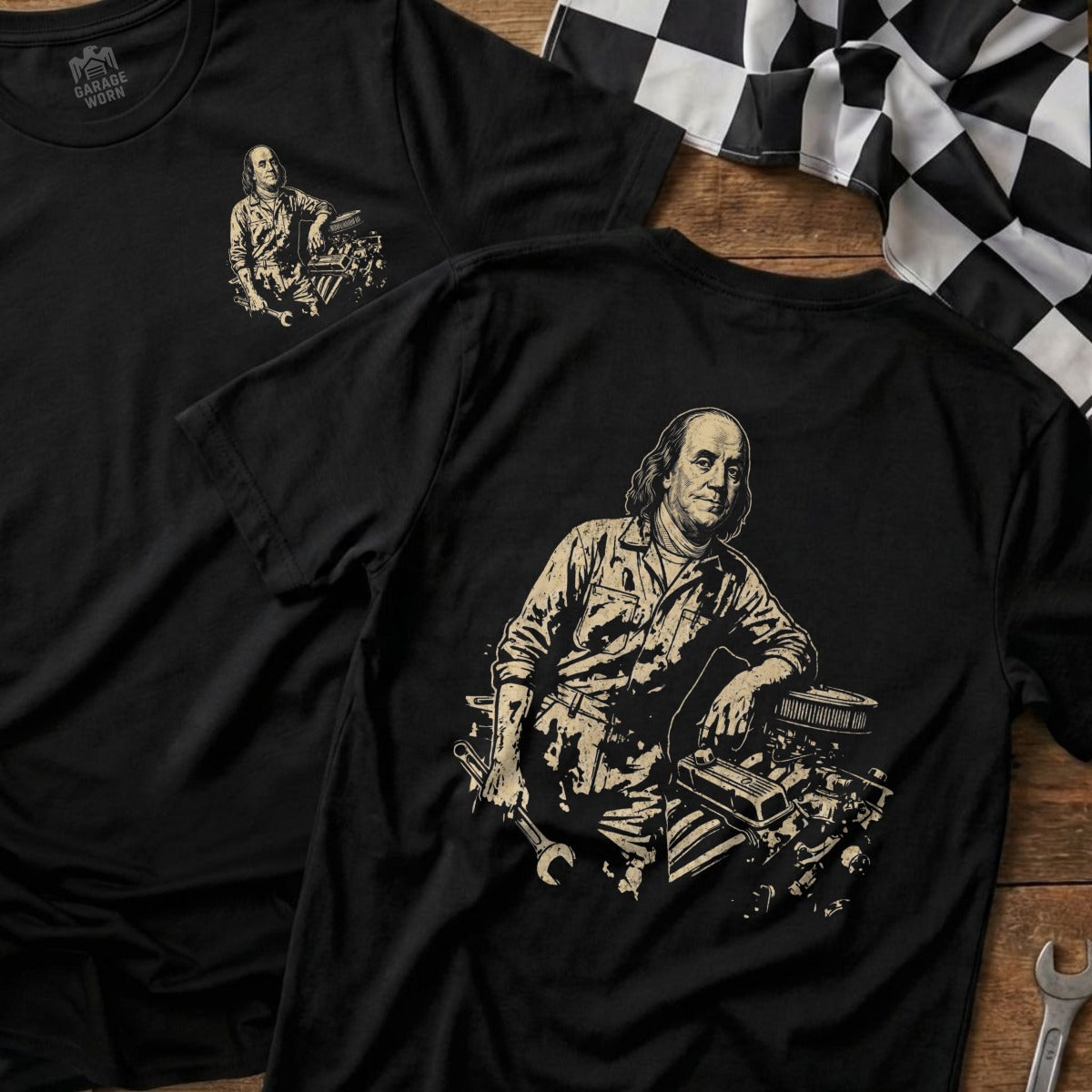 T-shirt with Benjamin Franklin leaning on car engine, holding wrench.