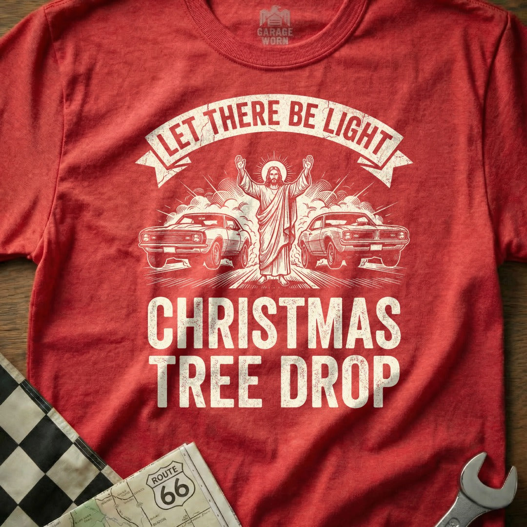 Red t-shirt with Jesus, cars, and "Christmas Tree Drop" text.