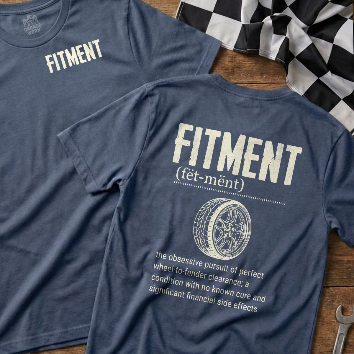 "FITMENT" text on navy blue t-shirt with dictionary definition and tire tread graphic.