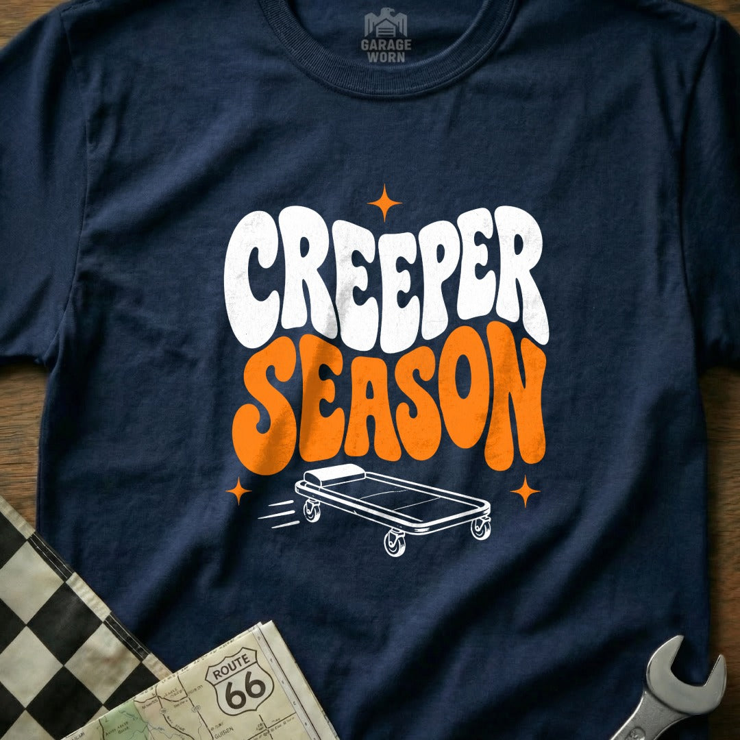 Navy t-shirt with "Creeper Season" text and a mechanic's creeper illustration.