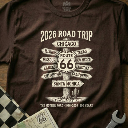 Brown t-shirt featuring "2026 Road Trip" and Route 66 destinations.