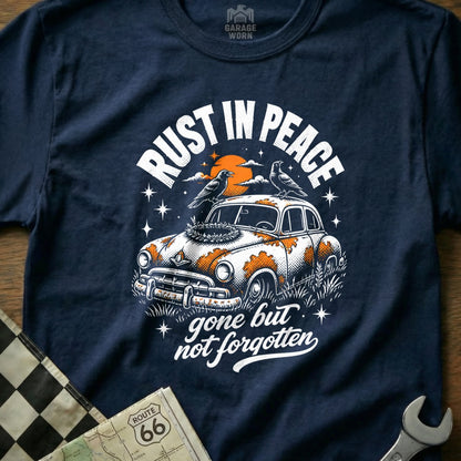 Navy t-shirt graphic with vintage car, birds, and "Rust in Peace" text.