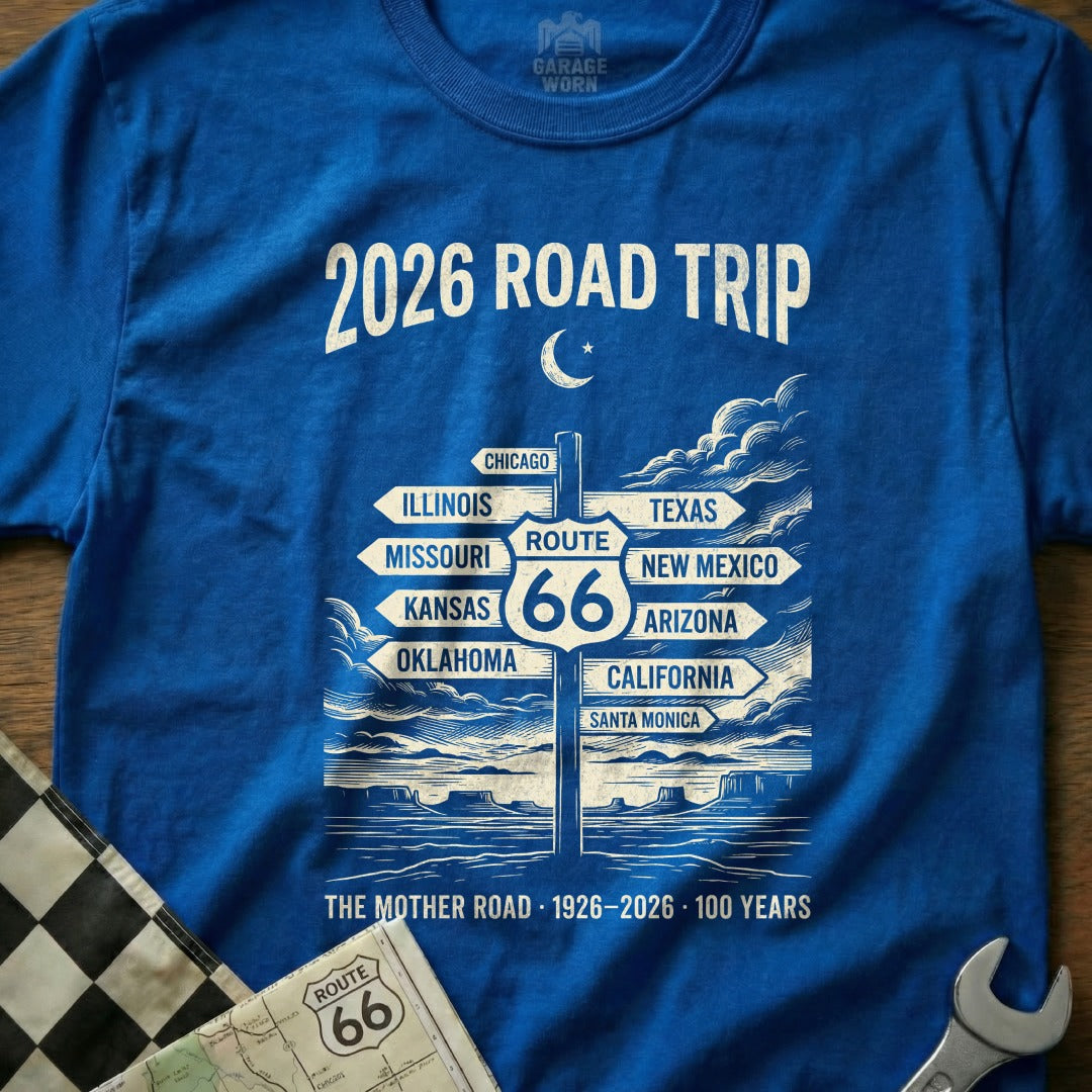Blue t-shirt with "2026 Road Trip" and Route 66 destination signs.