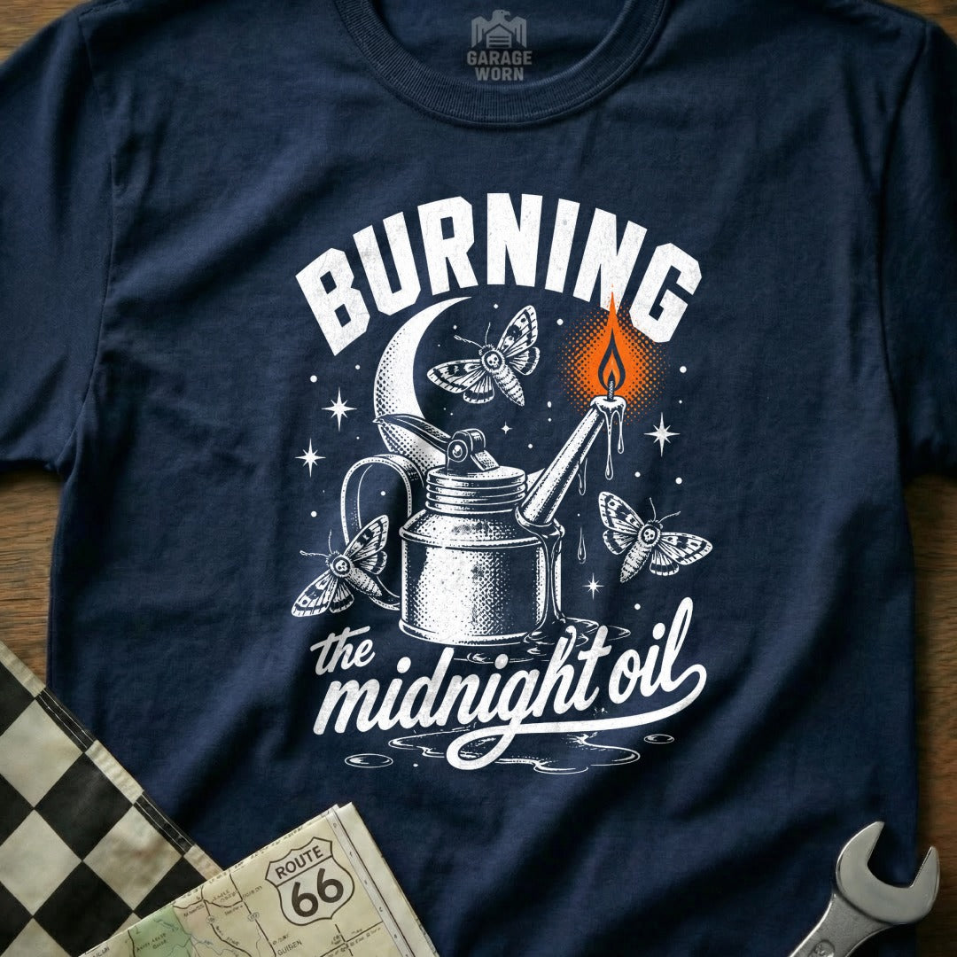 T-shirt graphic with oil can, moths, moon, and "Burning the midnight oil" text.