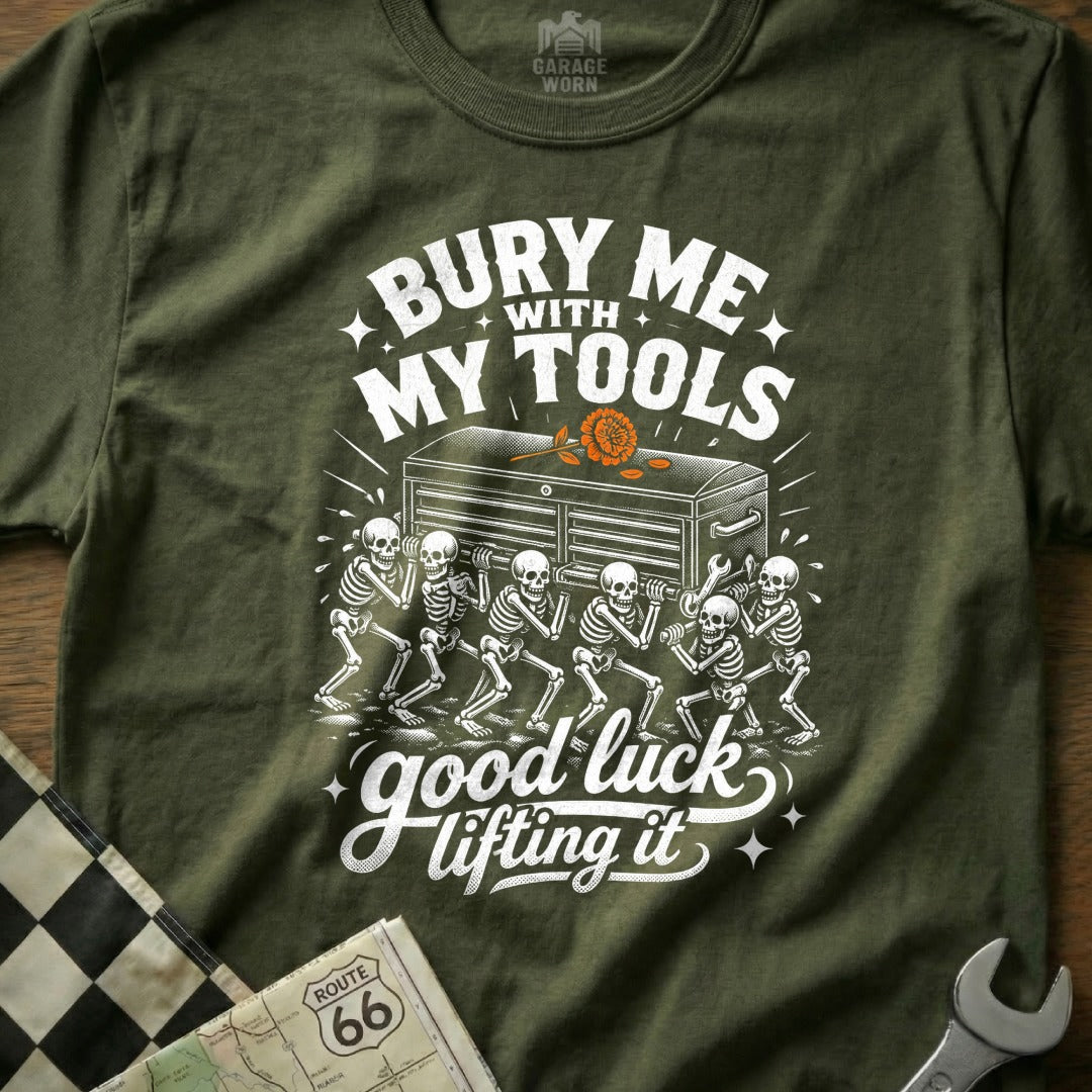 Green t-shirt with skeletons carrying a toolbox, "Bury Me With My Tools, Good Luck Lifting It."