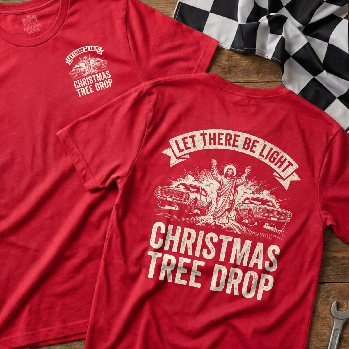Red t-shirt with "Let There Be Light Christmas Tree Drop" graphic.