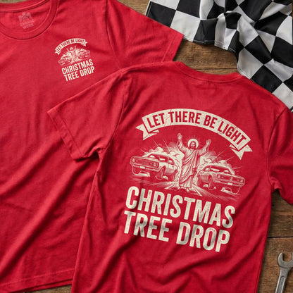 Red t-shirt with "Let There Be Light Christmas Tree Drop" graphic.