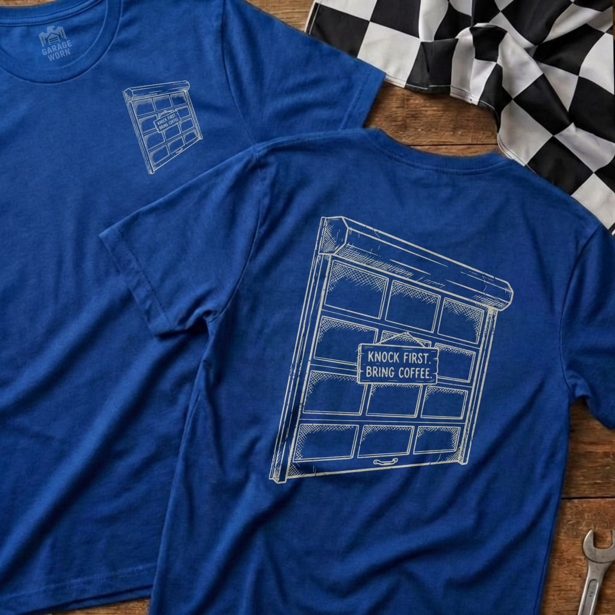 Blue t-shirts with a sketched garage door and text "Knock first. Bring coffee."
