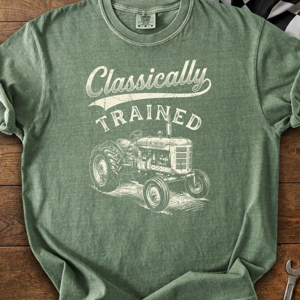 Green t-shirt with text "Classically TRAINED" and a vintage tractor graphic.