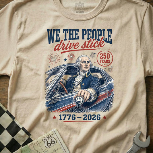 George Washington in car with manual gear shift, "We The People Drive Stick" text.
