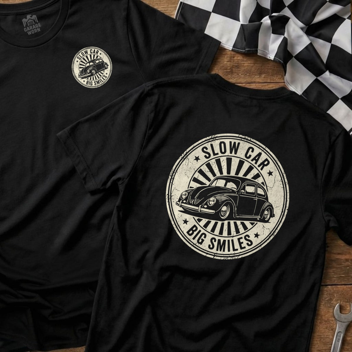 Black t-shirt with circular graphic "Slow Car, Big Smiles" and vintage Beetle.