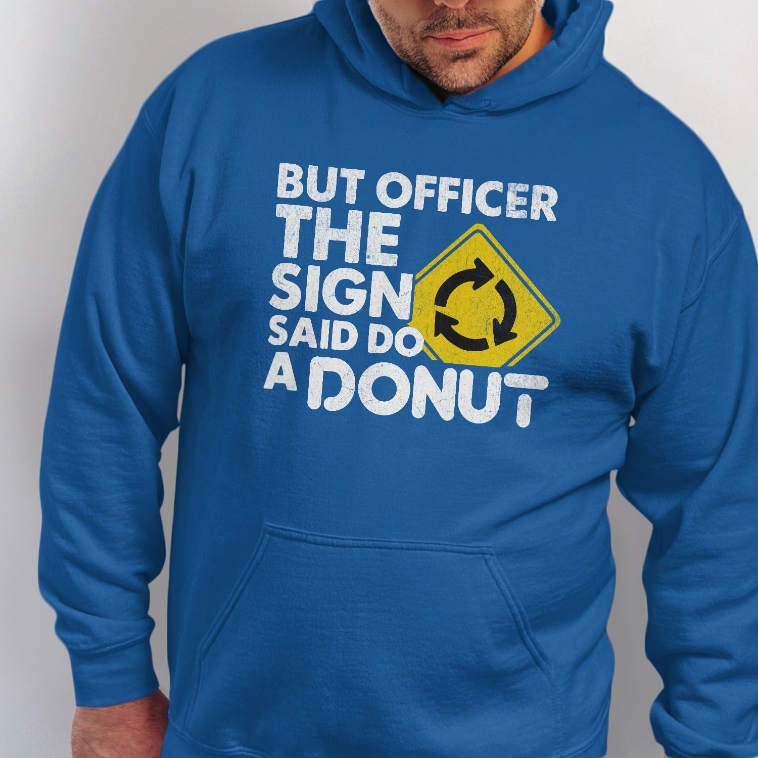 Blue hoodie with "But Officer The Sign Said Do A DONUT" text and roundabout symbol.