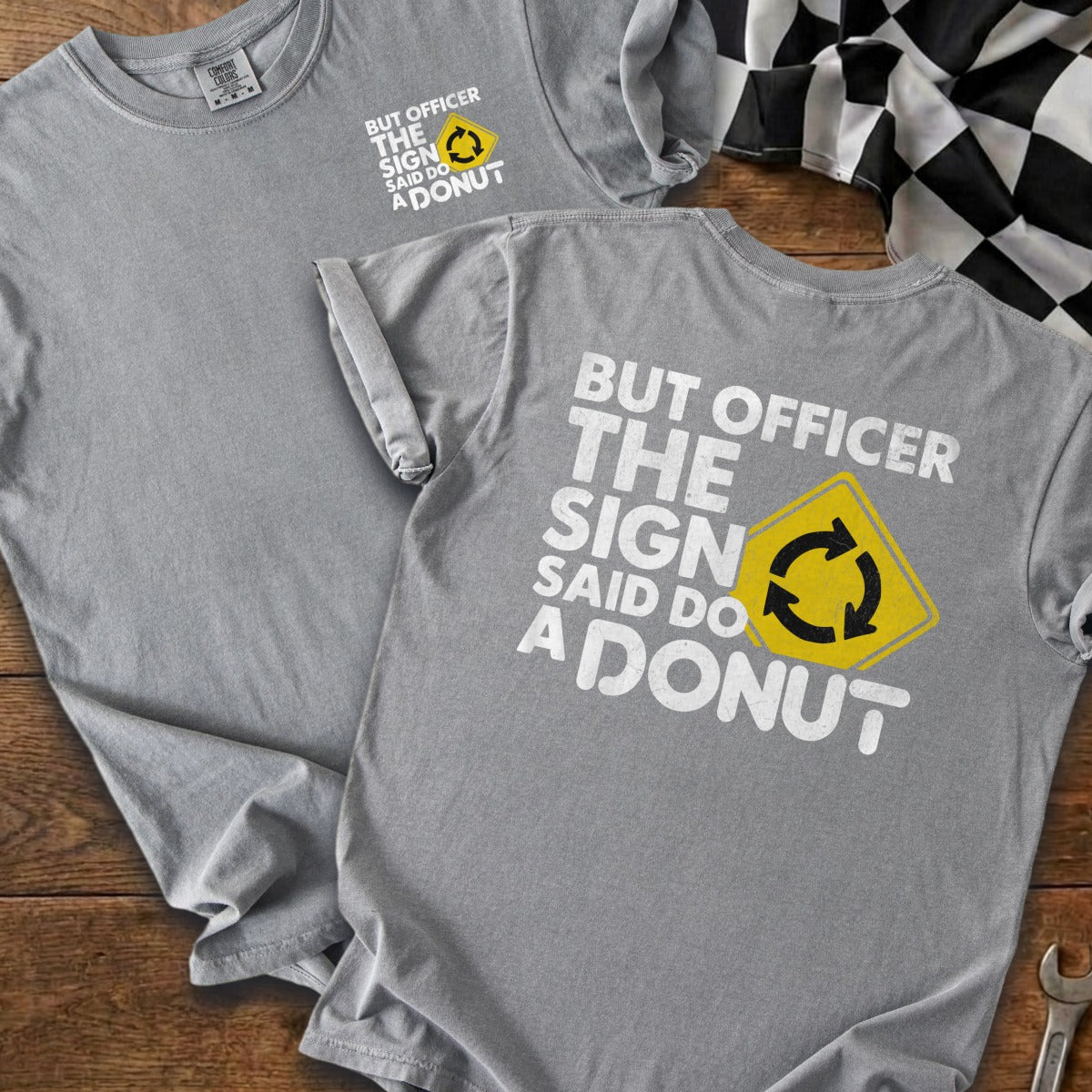 Grey t-shirts with "But Officer The Sign Said Do A Donut" text and traffic sign.
