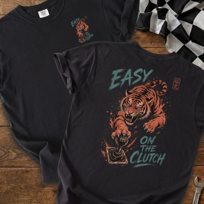 Black t-shirt with a tiger gripping a gear shift, text "EASY ON THE CLUTCH".