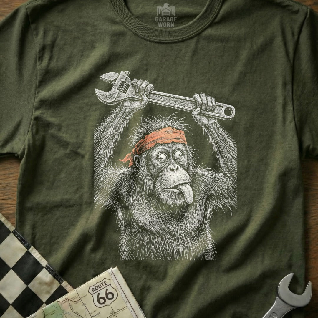 Orangutan wearing a bandana, sticking tongue out, holding a wrench.