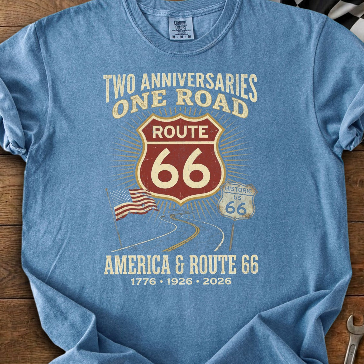 Blue t-shirt with "America & Route 66" graphic and anniversary dates.