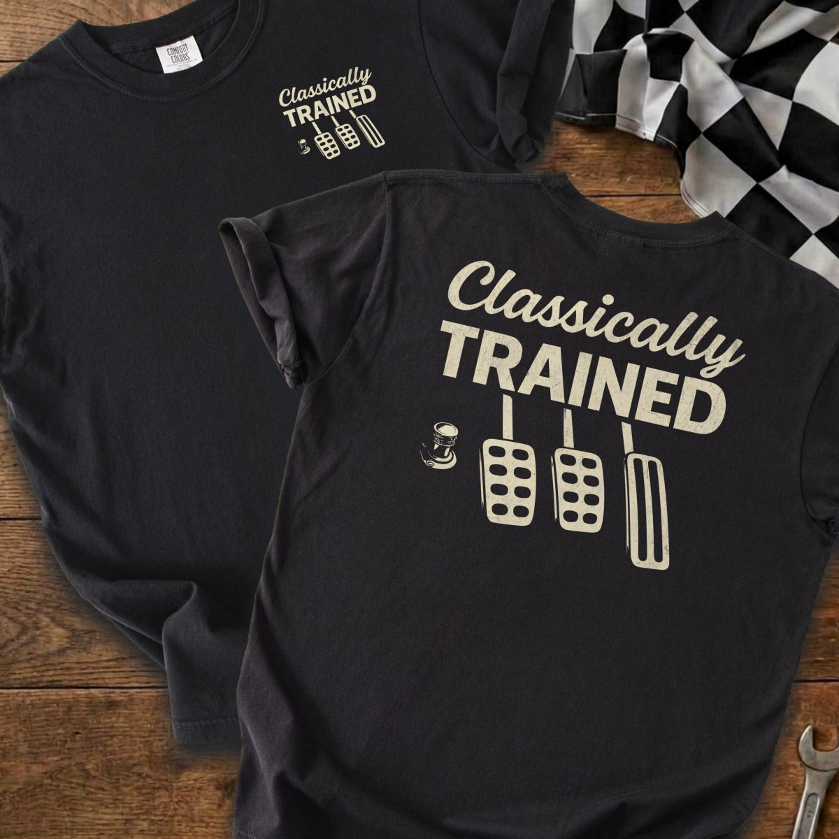 Black t-shirt with "Classically Trained" and clutch, brake, accelerator pedals graphic.