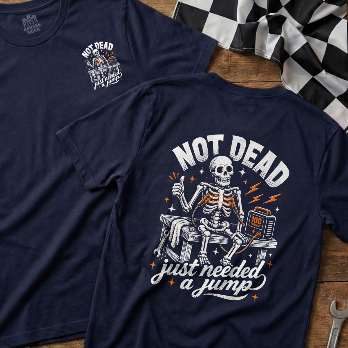 Navy t-shirt with skeleton, jumper cables, and "NOT DEAD just needed a jump" text.