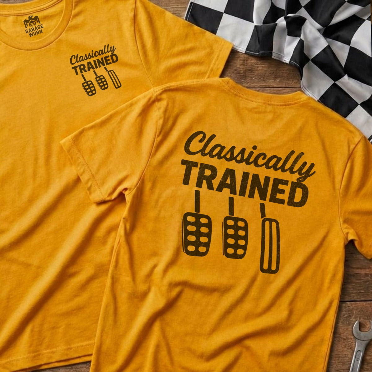 Two orange t-shirts with "Classically Trained" and pedal graphic.