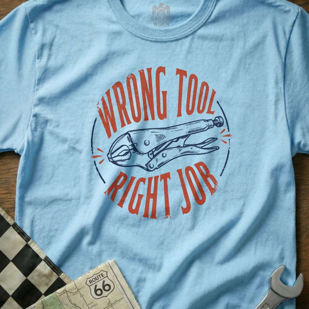Light blue t-shirt with "WRONG TOOL RIGHT JOB" and a pair of pliers.