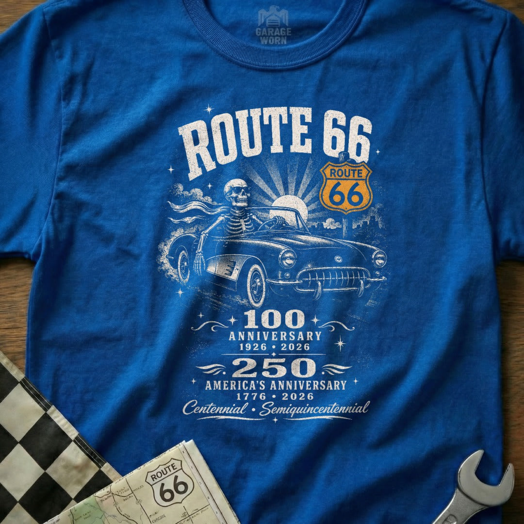 Blue t-shirt with Route 66 logo, skeleton driving a classic car, and anniversary dates.