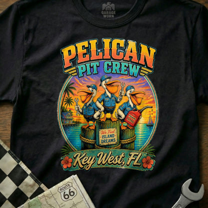 Pelican Pit Crew graphic with three pelicans holding tools, Key West, FL text.