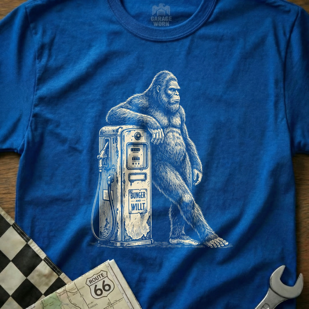 Bigfoot leaning on a vintage gas pump with "BUNGER AND WILLT" text.