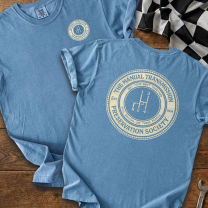 Blue t-shirt with "The Manual Transmission Preservation Society" graphic and gear shift.