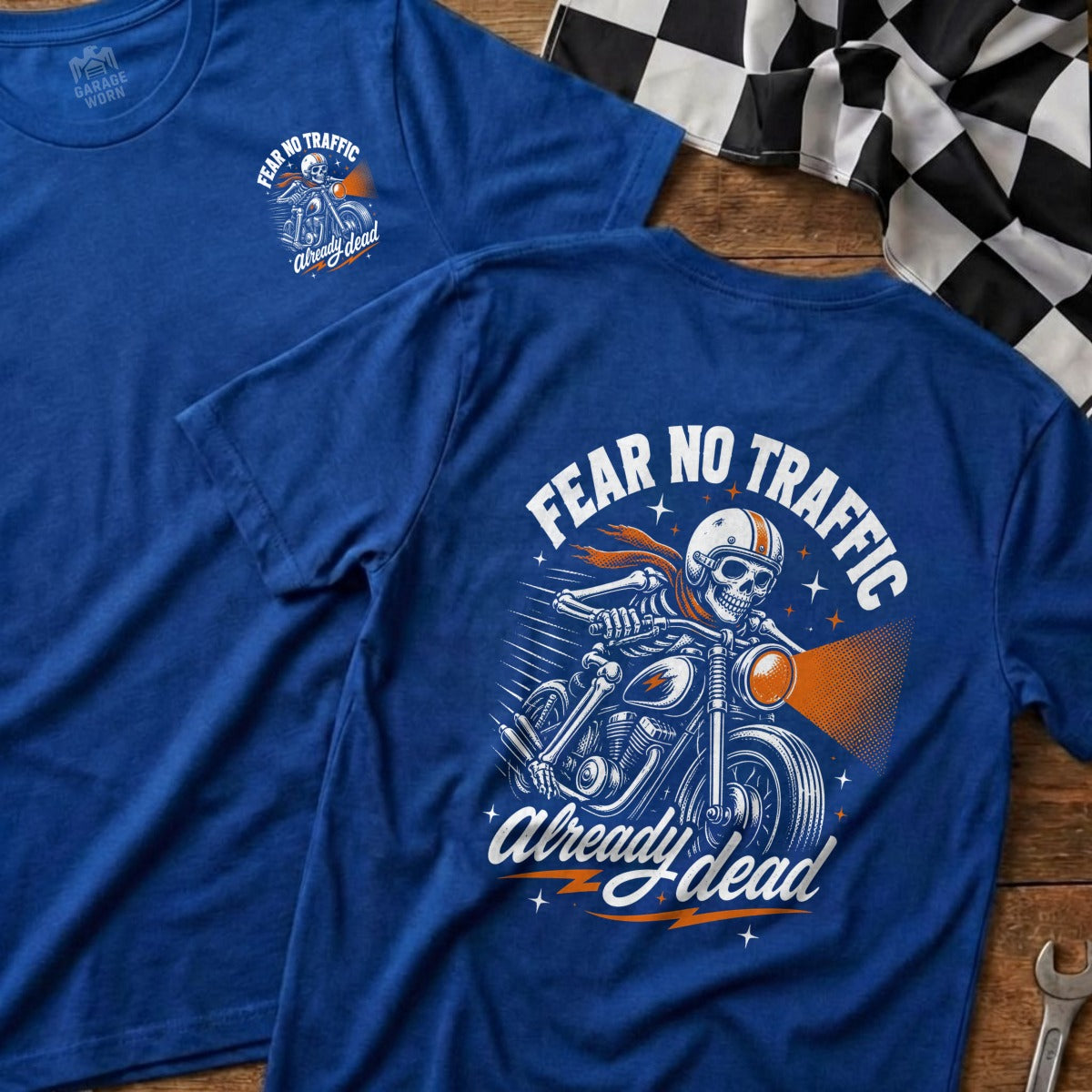 Blue t-shirt with skeleton on motorcycle graphic and text "Fear No Traffic Already Dead".