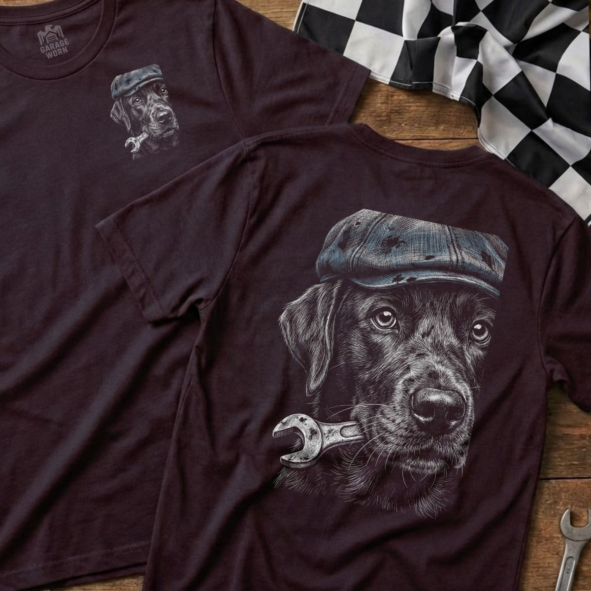 T-shirt with a black dog wearing a cap holding a wrench.