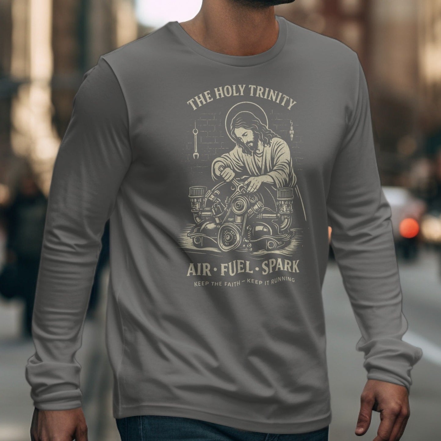 Jesus working on engine with text "The Holy Trinity, Air. Fuel. Spark."