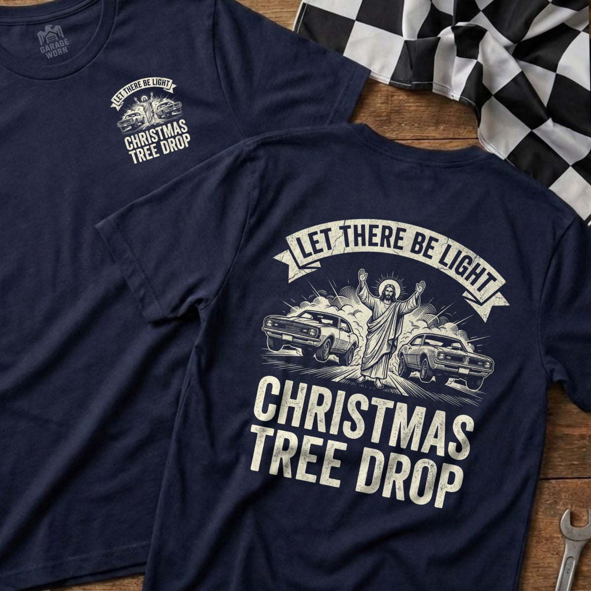 Navy t-shirts with "Let There Be Light Christmas Tree Drop" and Jesus between cars.