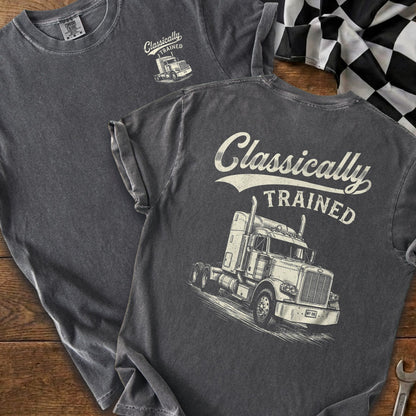 Dark grey t-shirt featuring a graphic of a semi-truck and the text "Classically TRAINED".