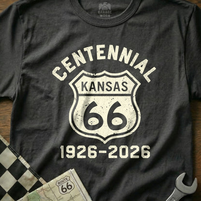 Black t-shirt with white "Centennial Kansas 66 1926-2026" text on a Route 66 shield.