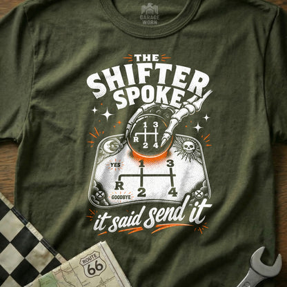Green t-shirt with "The Shifter Spoke" graphic featuring a skeleton hand on a gear shift and "it said send it."