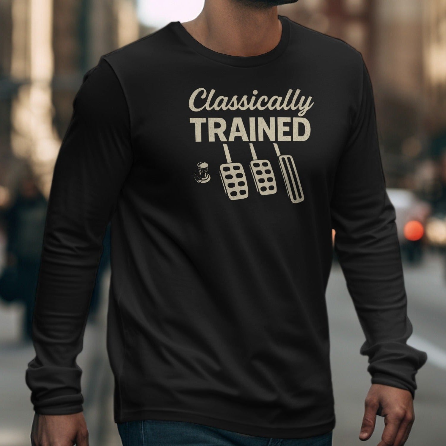 Black long sleeve shirt with "Classically TRAINED" and three pedals graphic.