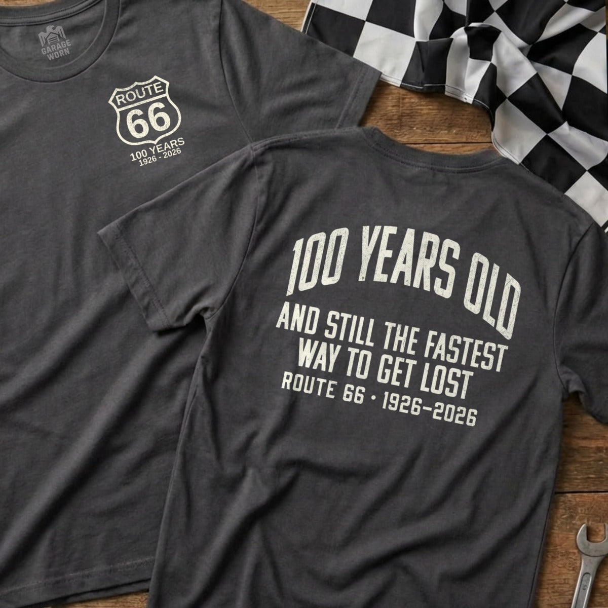 Dark gray t-shirt celebrating 100 years of Route 66 with racing flag.