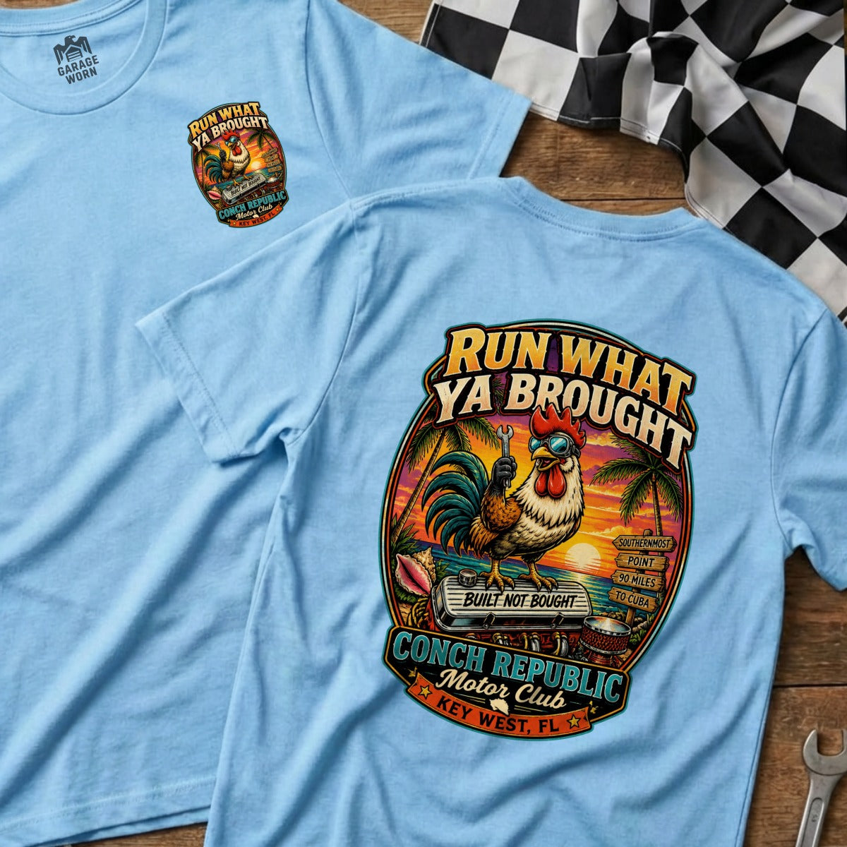 Light blue t-shirt with "Run What Ya Brought" graphic featuring a rooster, engine, and Key West, FL.