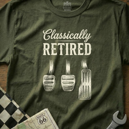 Olive t-shirt with "CLASSICALLY RETIRED" above three car pedals.