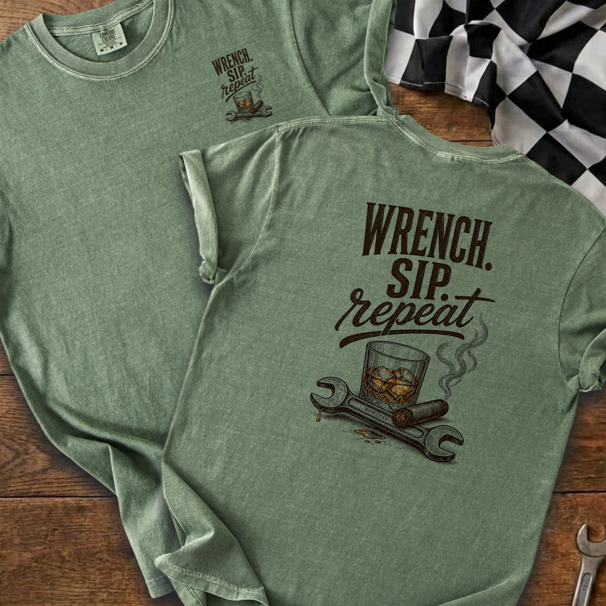 Sage green t-shirt with "Wrench. Sip. Repeat." graphic and racing flag.