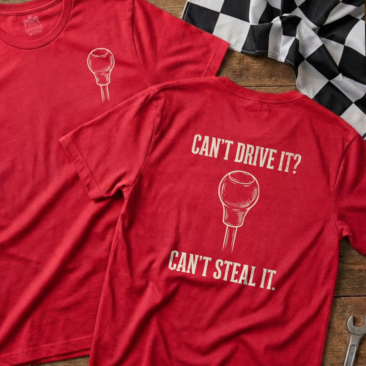 Red t-shirts with gear shift graphic and text: "Can't Drive It? Can't Steal It."