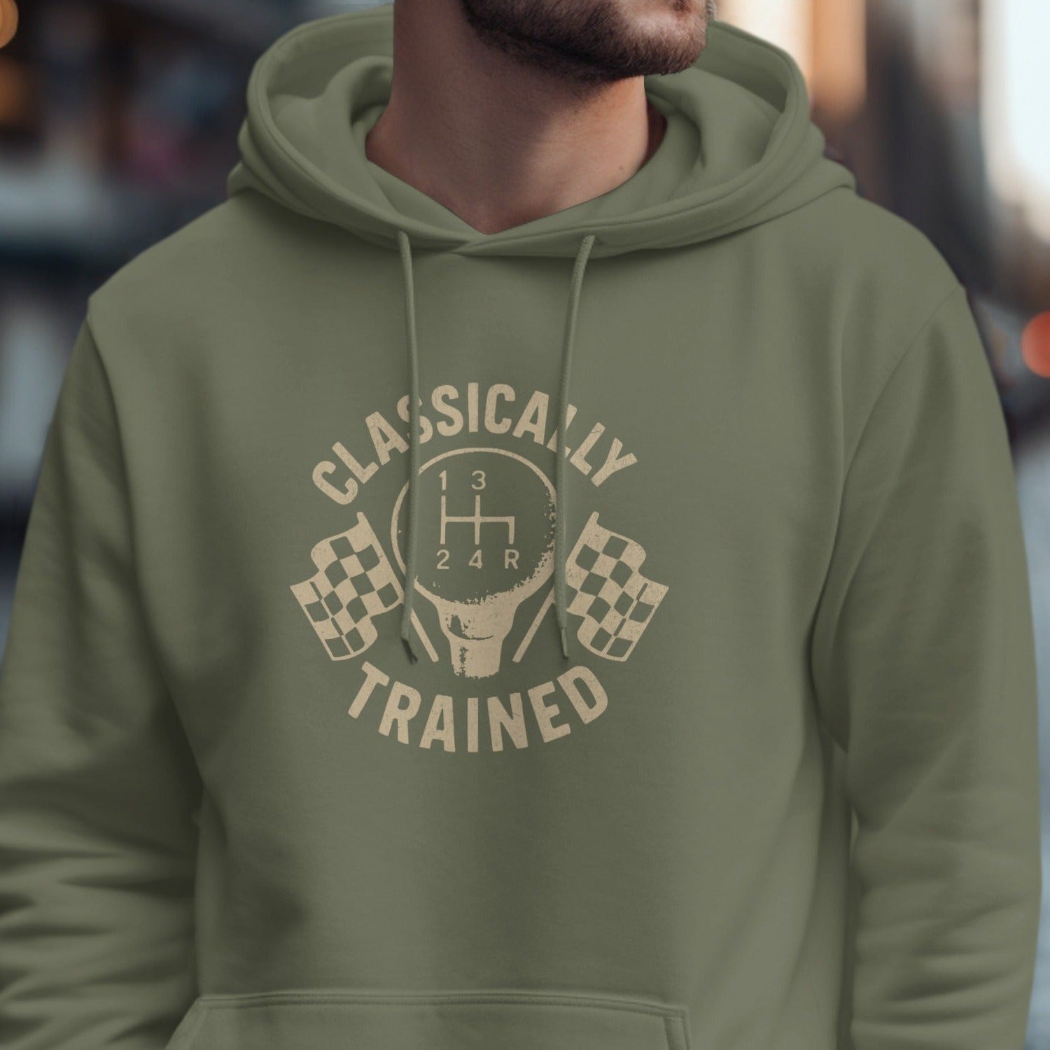 Olive green hoodie with "CLASSICALLY TRAINED" text and gear shift graphic.