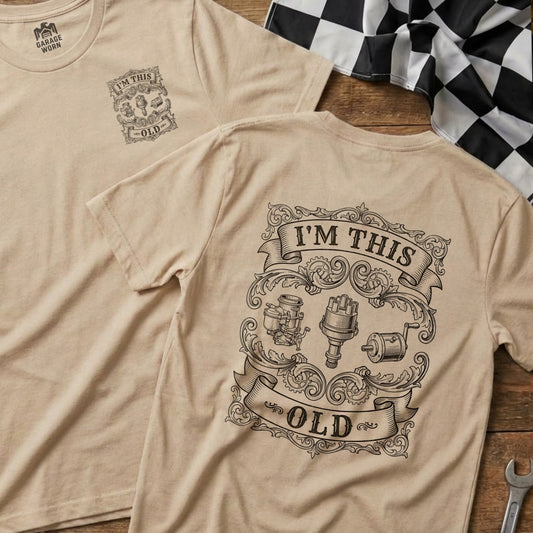 T-shirt with "I'm This Old" text and vintage car parts on a tan background.
