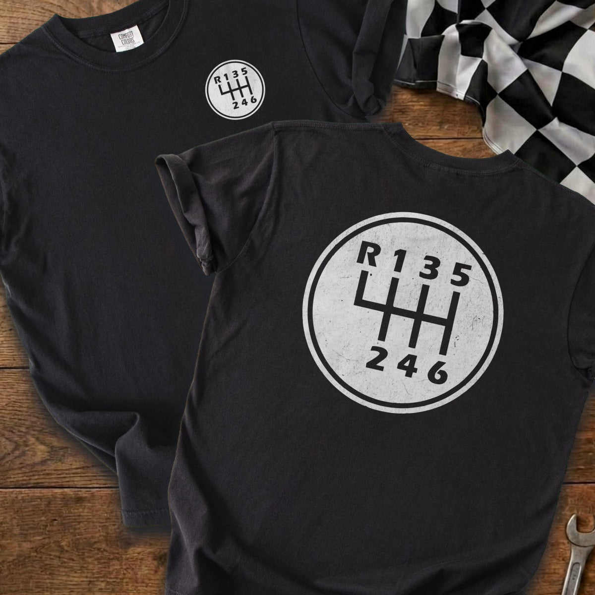 Black t-shirts feature a white manual transmission shift pattern graphic.
