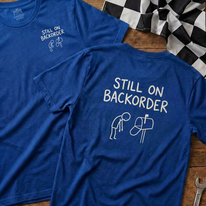 Two blue t-shirts with "Still on Backorder" graphic and text.