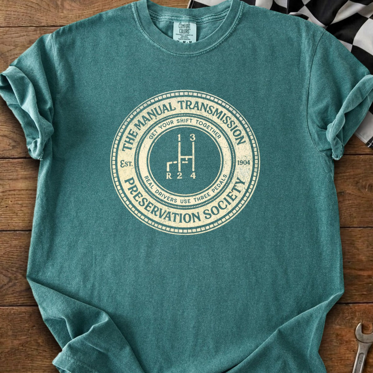 T-shirt with "The Manual Transmission Preservation Society" and a gear shift graphic.