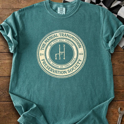 T-shirt with "The Manual Transmission Preservation Society" and a gear shift graphic.