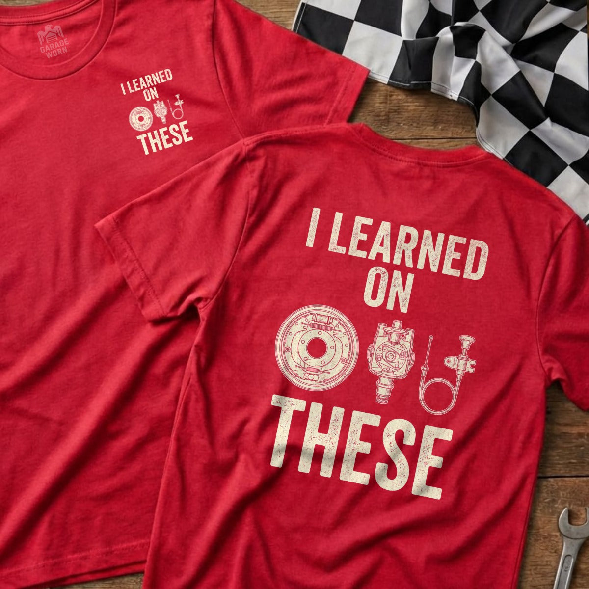 Red t-shirt with "I learned on these" and mechanical illustration.